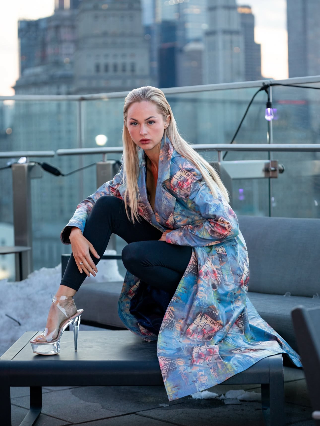 Model in a printed coat photographed on a New York rooftop for PostUp NYC